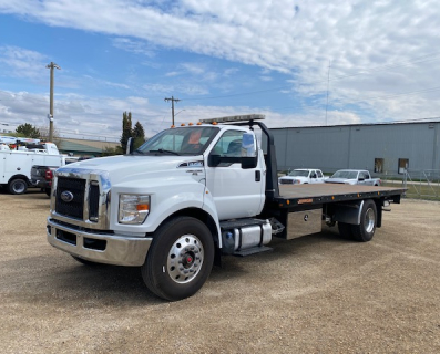 White rollback truck